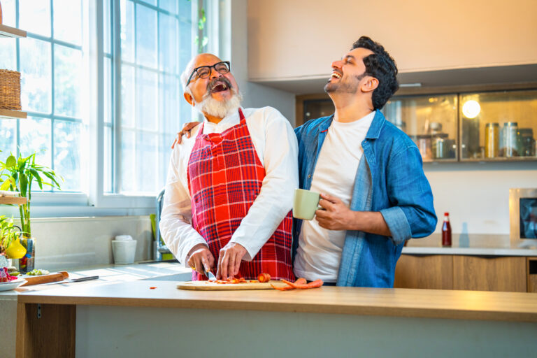 Dad and child enjoying quality time while preparing food in a renovated kitchen.